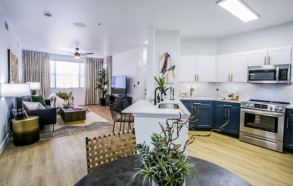 Modern kitchen with stainless steel appliances at The Presley at Whitney Ranch Homes