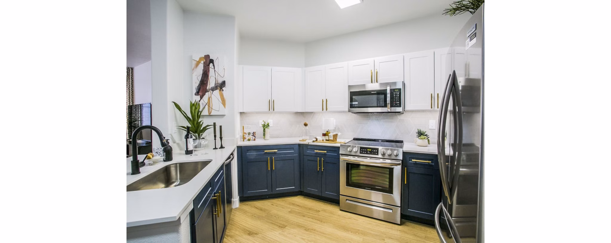 Modern kitchen with stainless steel appliances at The Presley, Whitney Ranch homes
