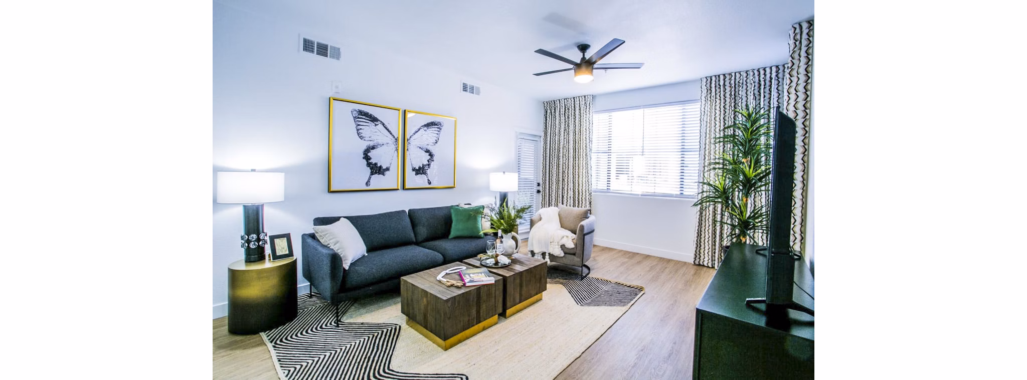 Living room at The Presley: Elegant decor with modern furnishings in Whitney Ranch Apartments