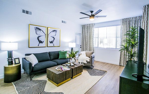 Living room at The Presley: Elegant decor with modern furnishings in Whitney Ranch Apartments