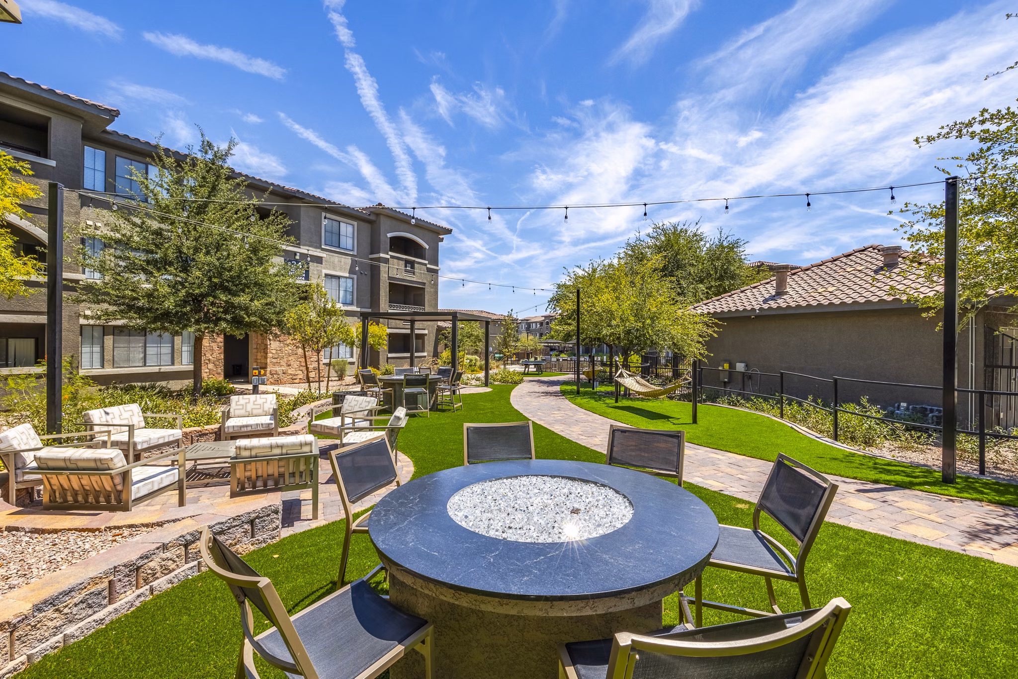 Cozy fire pit on outdoor patio at The Presley at Whitney Ranch Apartments, ideal for relaxation and social gatherings