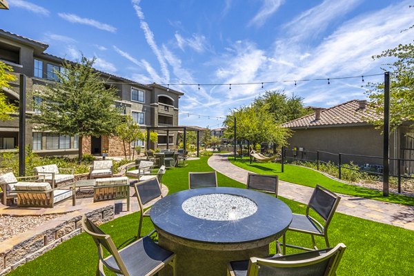 Cozy fire pit on outdoor patio at The Presley at Whitney Ranch Apartments, ideal for relaxation and social gatherings