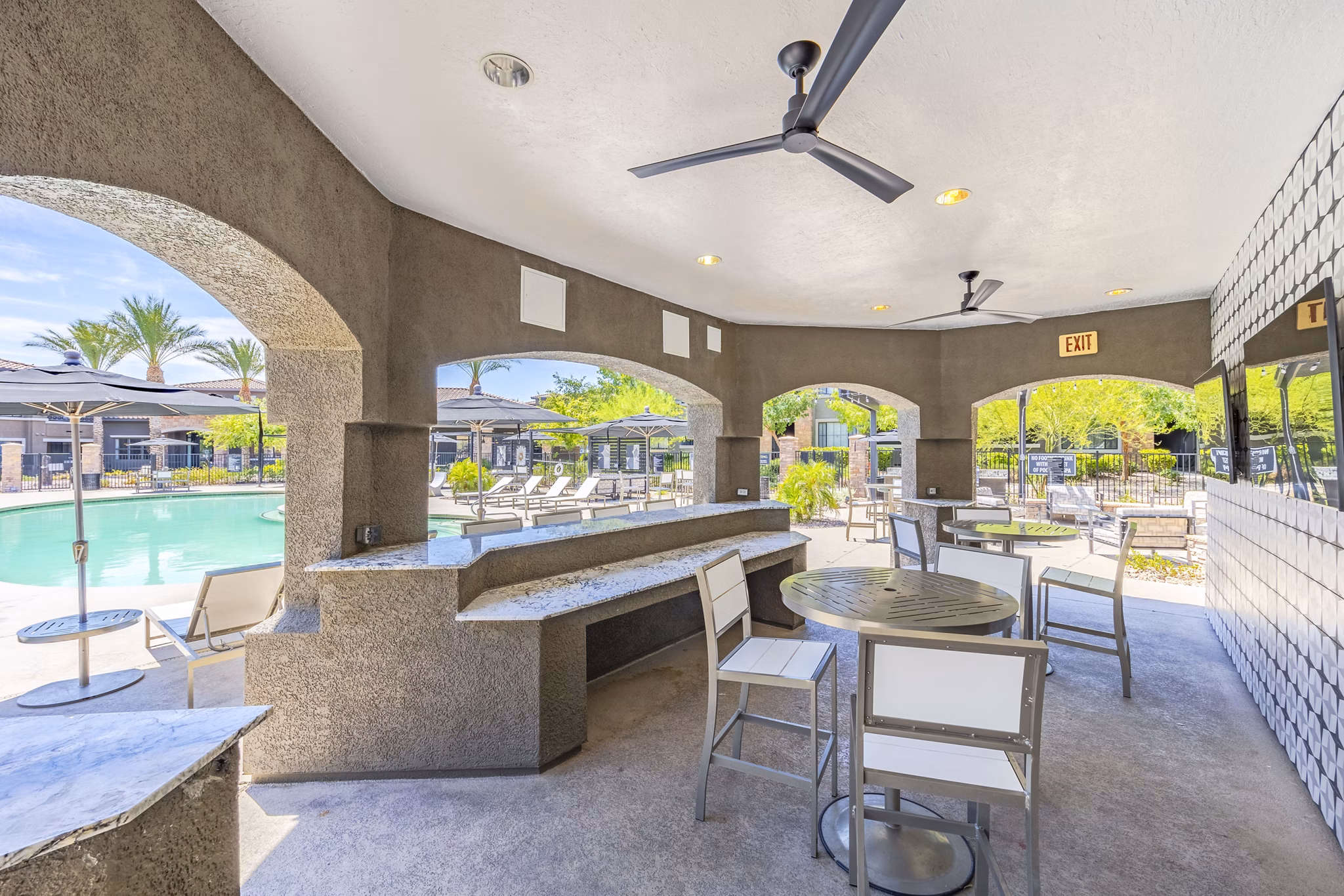Patio view with cozy seating arrangements at The Presley at Whitney Ranch Apartments, ideal for outdoor relaxation and gatherings