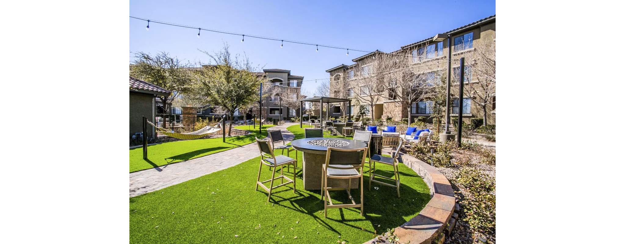 Cozy fire pit on relaxing patio at The Presley at Whitney Ranch Apartments