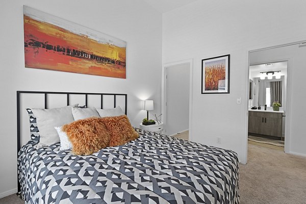 Cozy bedroom with modern furnishings at Townhomes at Horizon Ridge Apartments