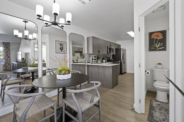 Dining area with sleek modern design at Townhomes at Horizon Ridge Apartments, featuring stylish decor and ample seating arrangements