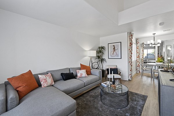 Modern kitchen with stainless steel appliances in Townhomes at Horizon Ridge Apartments