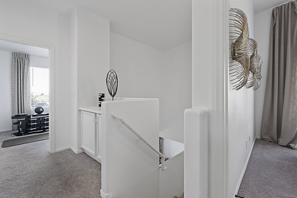 Modern kitchen with stainless steel appliances in Townhomes at Horizon Ridge Apartments