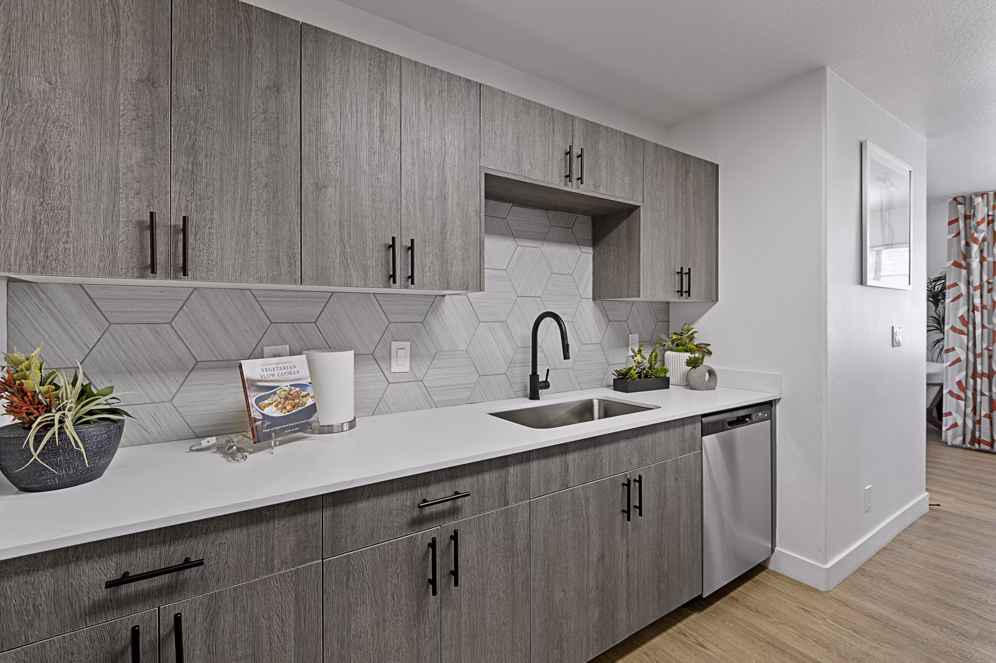 Modern kitchen featuring stainless steel appliances at Townhomes at Horizon Ridge Apartments