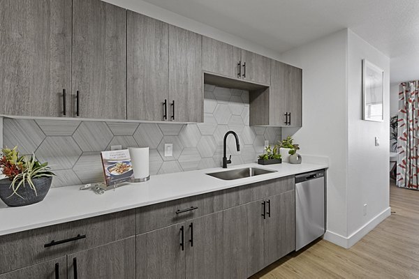 Modern kitchen featuring stainless steel appliances at Townhomes at Horizon Ridge Apartments