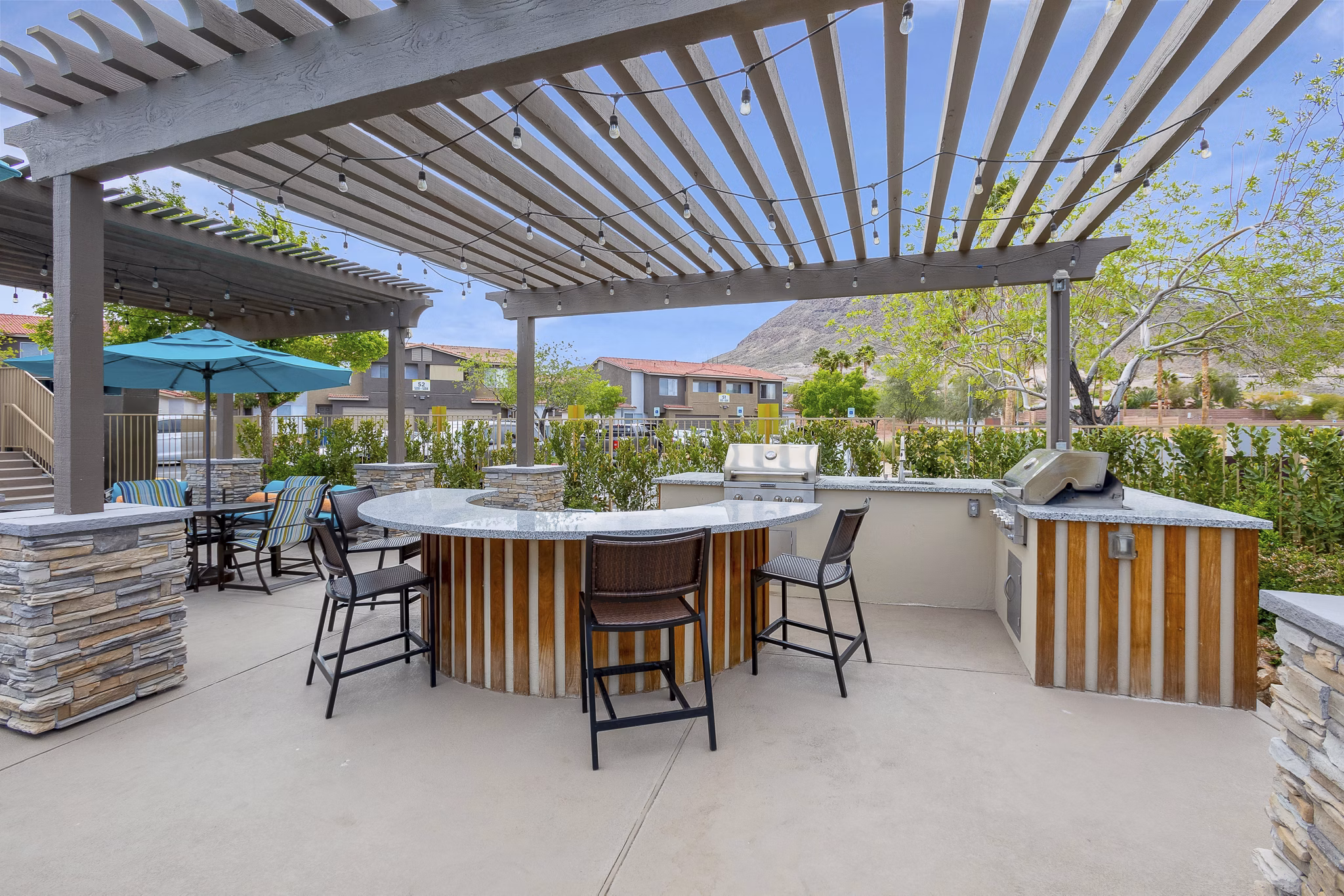 Grill area at Townhomes at Horizon Ridge featuring outdoor seating and BBQ stations