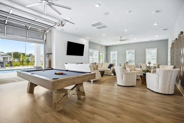 clubhouse game room at River Rock at Blume Road Apartment Homes