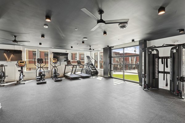 State-of-the-art fitness center with modern equipment at The Navigator Apartments