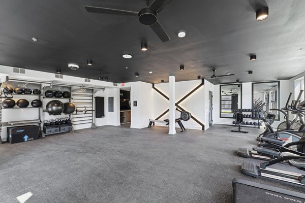 State-of-the-art fitness center with cardio and strength equipment at The Navigator Apartments