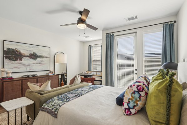 Spacious bedroom with modern decor in The Navigator Apartments