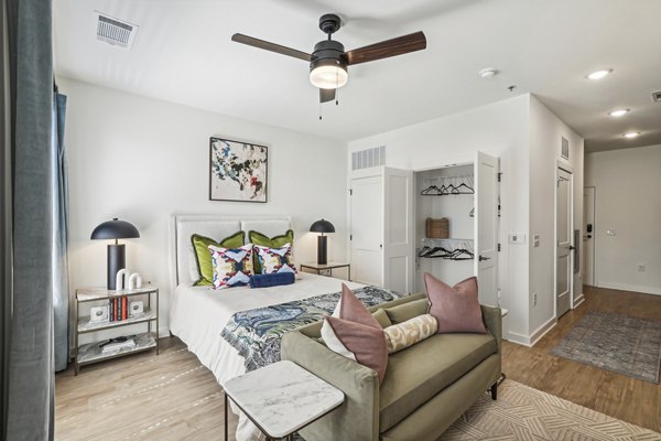 Cozy bedroom with modern furnishings at The Navigator Apartments