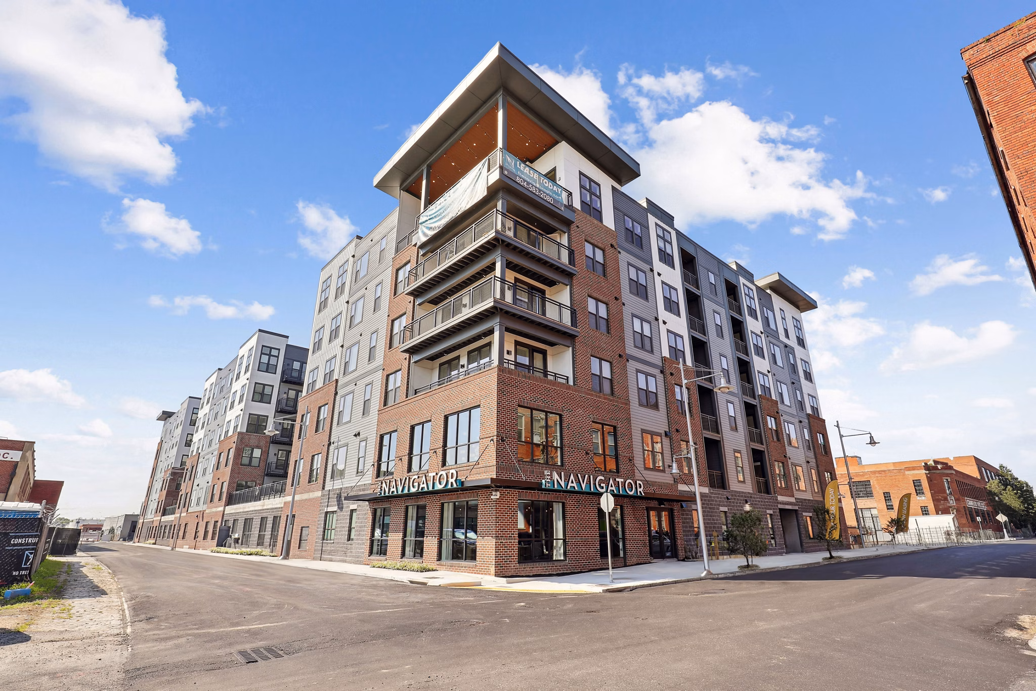 The Navigator Apartments: Contemporary architecture of luxury high-rise building in vibrant urban setting