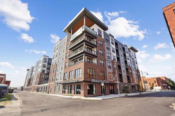 The Navigator Apartments: Contemporary architecture of luxury high-rise building in vibrant urban setting