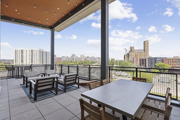 Cozy patio with outdoor seating at The Navigator Apartments, perfect for relaxation and gatherings in a luxury setting