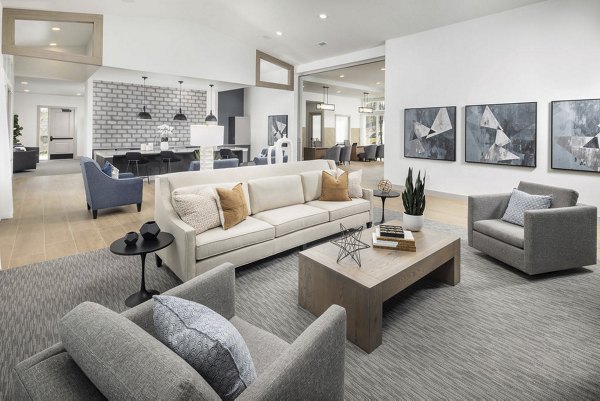 Clubhouse featuring modern design and seating areas at Prose Columbus Apartments