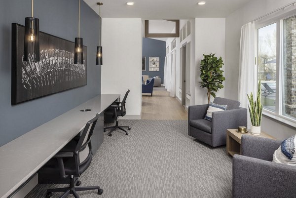 Stylish clubhouse with modern seating and pool table at Prose Columbus Apartments, offering a social hub for residents