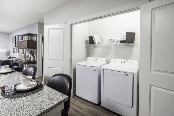 Laundry room with modern appliances at Prose Columbus Apartments, offering convenience for residents in a luxury setting