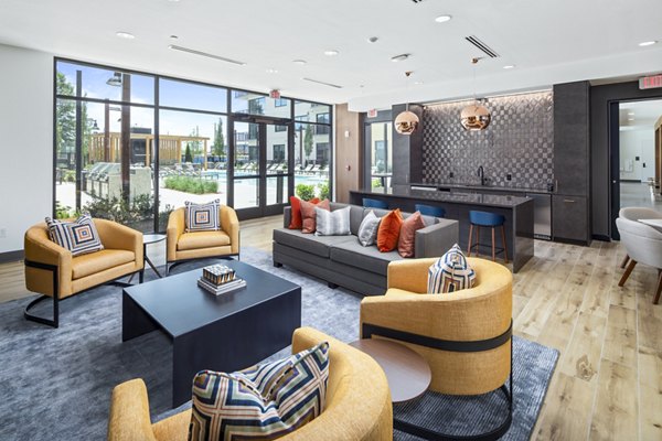 Clubhouse featuring modern decor and open seating at The Grace Residences Apartments