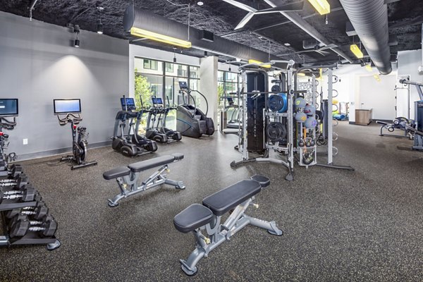 State-of-the-art fitness center with modern equipment at The Grace Residences Apartments