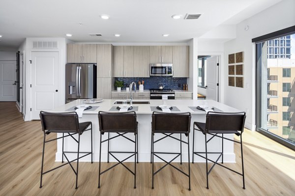 KITCHEN WITH MODERN APPLIANCES IN THE GRACE RESIDENCES