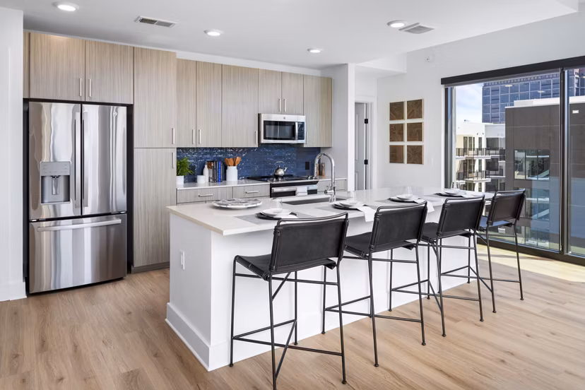 Modern kitchen with stainless steel appliances in The Grace Residences Apartments