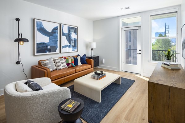 Spacious living room with modern decor at The Grace Residences Apartments