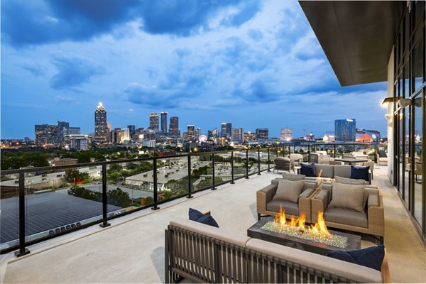 Fire pit and cozy lounge area on the patio at The Grace Residences, perfect for evenings outdoors