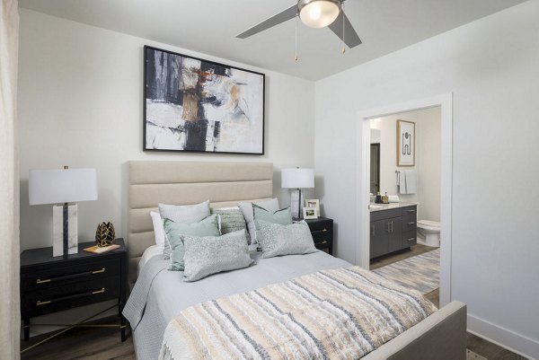 Comfortable bedroom with modern design at Bell's Lake Apartments, featuring neutral tones and stylish decor