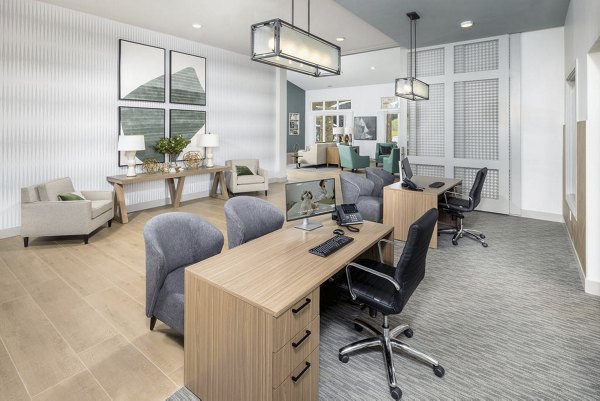 Clubhouse featuring modern entertainment and cozy seating at Prose LaGrange Apartments, a luxury community