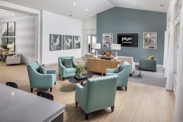Clubhouse featuring modern seating and large TV at Prose LaGrange Apartments
