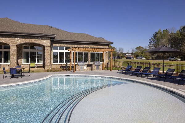 Inviting outdoor pool area at Prose LaGrange Apartments, perfect for relaxation and gatherings in a luxury setting