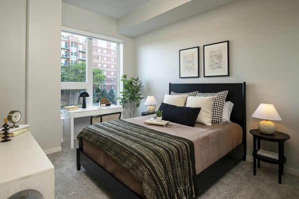 Cozy bedroom with modern design elements at Vyne on Haven Apartments