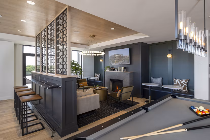 Elegant clubhouse with modern design elements at Vyne on Haven Apartments featuring luxury seating and ambient lighting