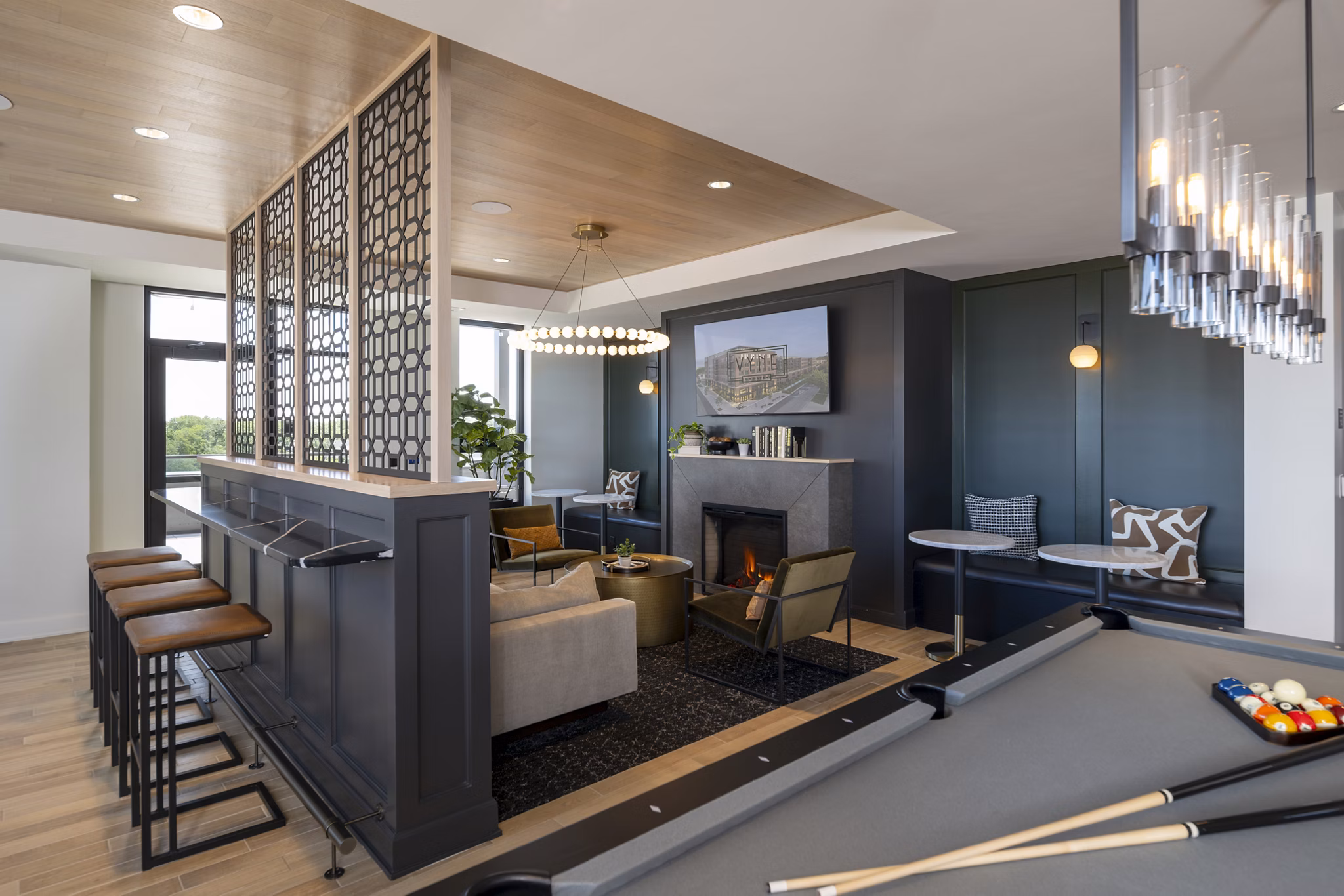 Elegant clubhouse with modern design elements at Vyne on Haven Apartments featuring luxury seating and ambient lighting