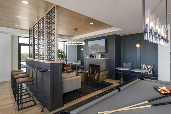 Elegant clubhouse with modern design elements at Vyne on Haven Apartments featuring luxury seating and ambient lighting