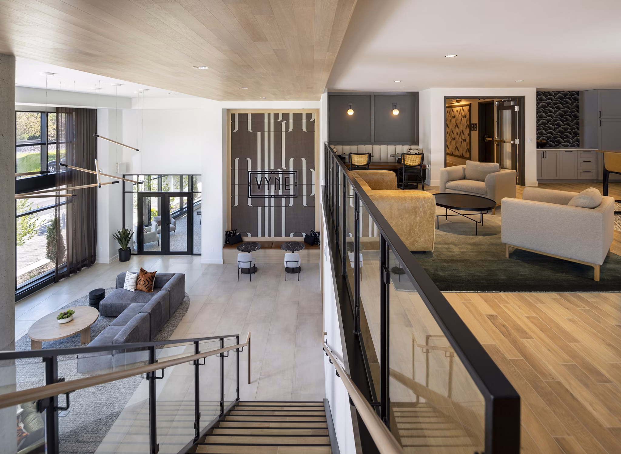 Clubhouse with modern design and comfortable seating at Vyne on Haven Apartments, a luxurious community in a serene setting