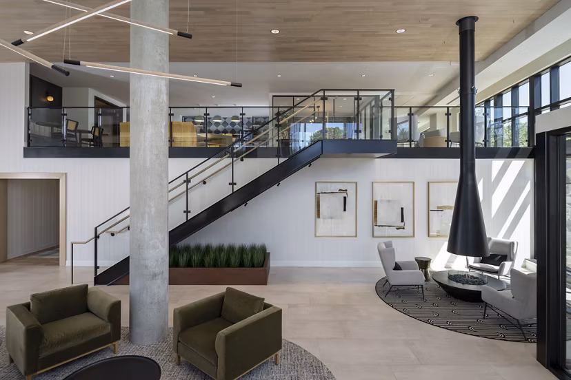 Elegant clubhouse featuring modern decor at Vyne on Haven Apartments with comfortable seating and entertainment options