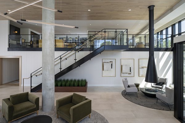 Elegant clubhouse featuring modern decor at Vyne on Haven Apartments with comfortable seating and entertainment options