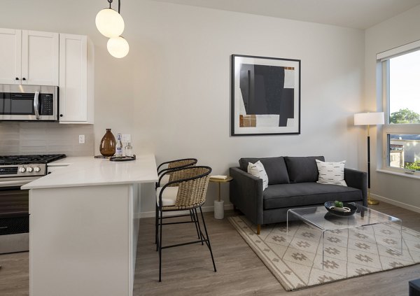 Spacious living room with modern decor at Vyne on Haven Apartments