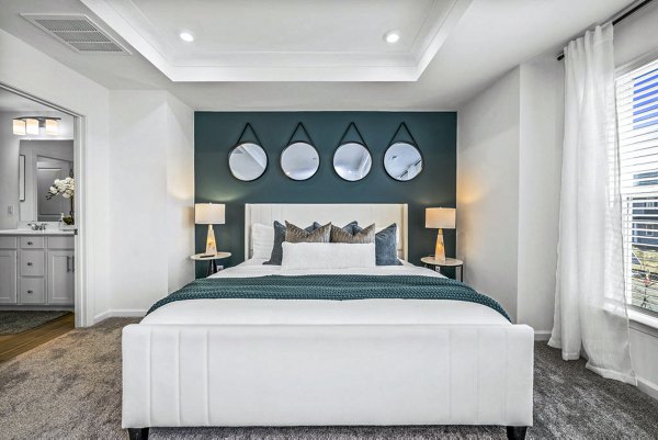 Cozy bedroom with modern decor at Wayford at Pringle Towns Apartments