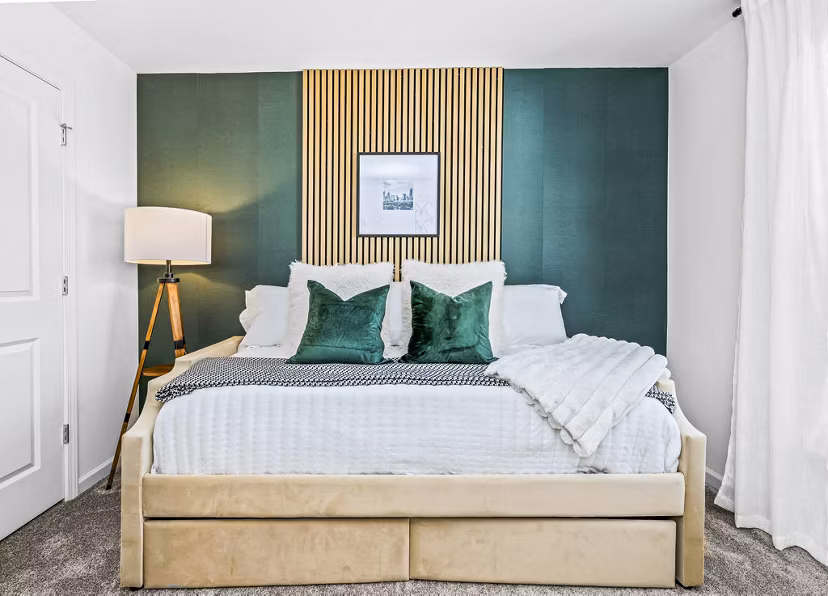 Cozy bedroom with elegant furnishings at Wayford at Pringle Towns Apartments