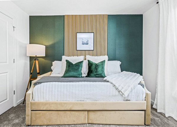 Cozy bedroom with elegant furnishings at Wayford at Pringle Towns Apartments