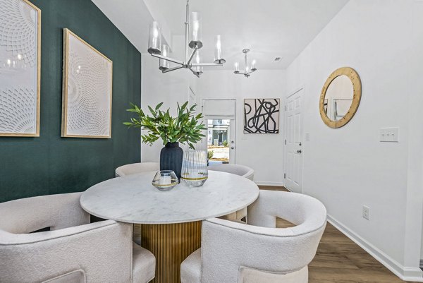 Entry and dining room with modern decor in Wayford at Pringle Towns Townhomes, luxury Greystar apartments