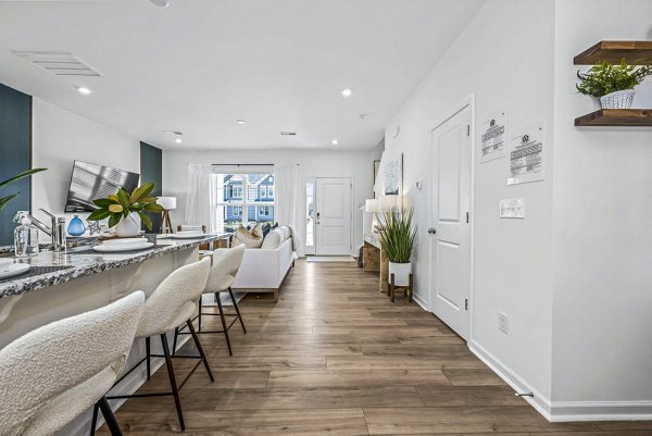 Modern kitchen with stainless steel appliances at Wayford at Pringle Towns Apartments