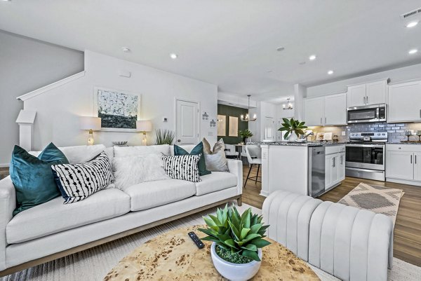 Spacious living room with modern furnishings at Wayford at Pringle Towns Apartments